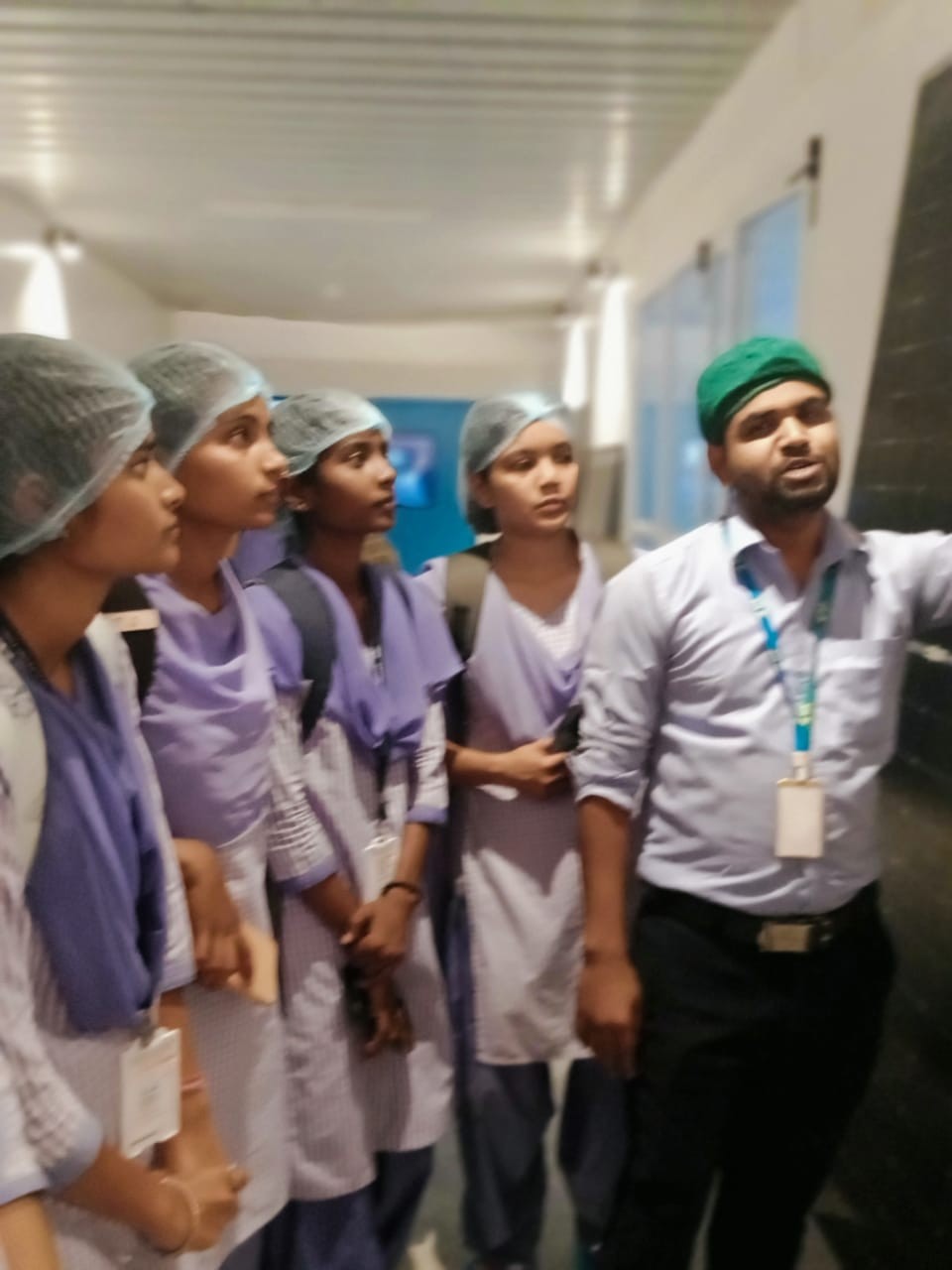 Company Engineer explaining details regarding solar panel manufacturing