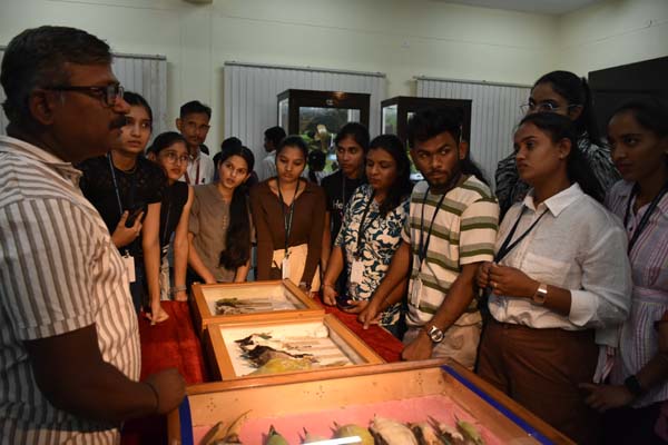 Scientist ZSI, WRC, Pune showing rare bird specimens & explaining the specimen tagging process